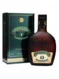 A bottle of Centenario Conmemorativo 9 Year Old Rum