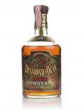 A bottle of Desmond& Duff 12 Year Old Deluxe Blended Scotch Whisky - 1970s