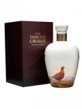 A bottle of Famous Grouse Celebration Blend / Wade Decanter Blended Scotch Whisky