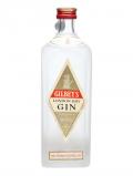A bottle of Gilbey's London Dry Gin / Frosted Glass / Bot.1960s