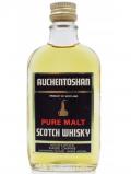A bottle of Auchentoshan Pure Malt Scotch Miniature