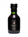 A bottle of Black Tot Navy Rum Miniature
