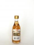A bottle of Guajiro Ron Miel Canario
