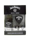 A bottle of Jack Daniels Miniature Earbud Headphones Gift Set