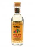 A bottle of Oro de Oaxaca Mezcal Miniature