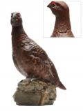 A bottle of Famous Grouse Ceramic Grouse (Matt) / Empty