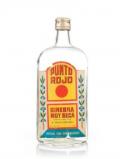 A bottle of Punto Rojo Ginebra Muy Seca - 1960s