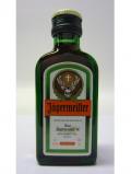 A bottle of Whisky Liqueur Jagermeister Miniature