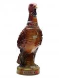 A bottle of Wild Turkey 8 Year Old Marroon Head Turkey / Empty Decanter