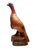 A bottle of Wild Turkey 8 Year Old Red& Cream Underbelly / Empty Decanter