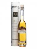 A bottle of Tosolini Grappa I Legni Rovere