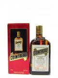 A bottle of Whisky Liqueurs Cointreau Tripple Sec 1980 S Bottling