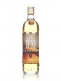 A bottle of De Luxe Prestige Gold Finest Blended Cane Liquor