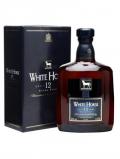 A bottle of White Horse 12 Year Old / Extra Fine Blended Scotch Whisky